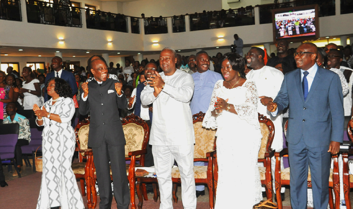  President Mahama singing praises at the service. Those with him are Prophet Annor (2nd left) and some government officials. Picture: EBOW HANSON